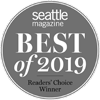 Circular badge saying "Seattle Magazine Best of 2019 Readers' Choice Winner" in white text on a gray background.