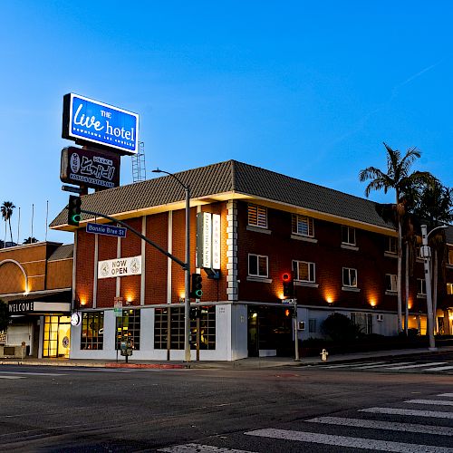 A street corner featuring a lit building identified as 