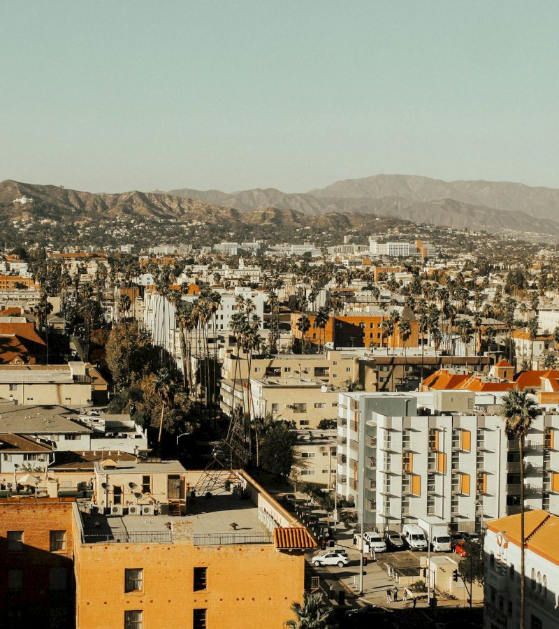 A cityscape view with mountains in the background